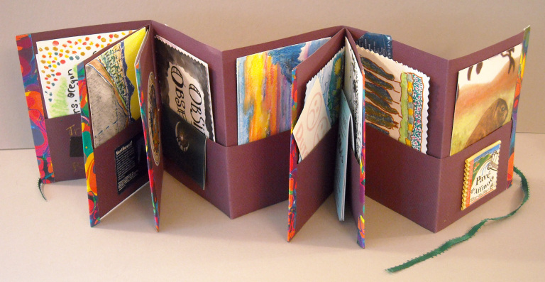 Accordion fold book with pockets, mixed media. NFS